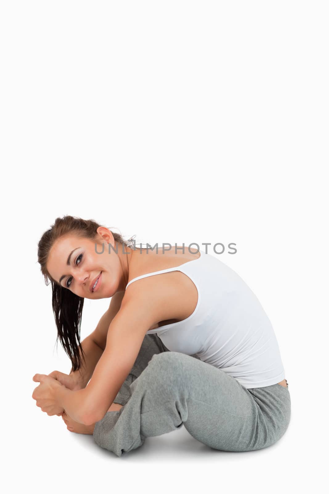 Portrait of a fit woman stretching her legs by Wavebreakmedia