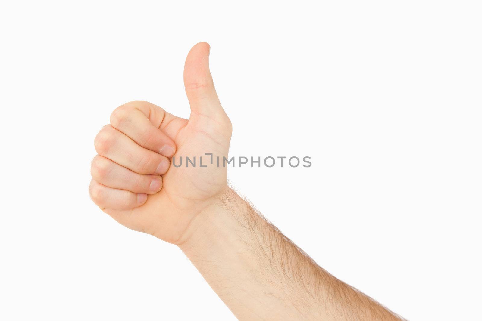 Side view of thumb up against a white background