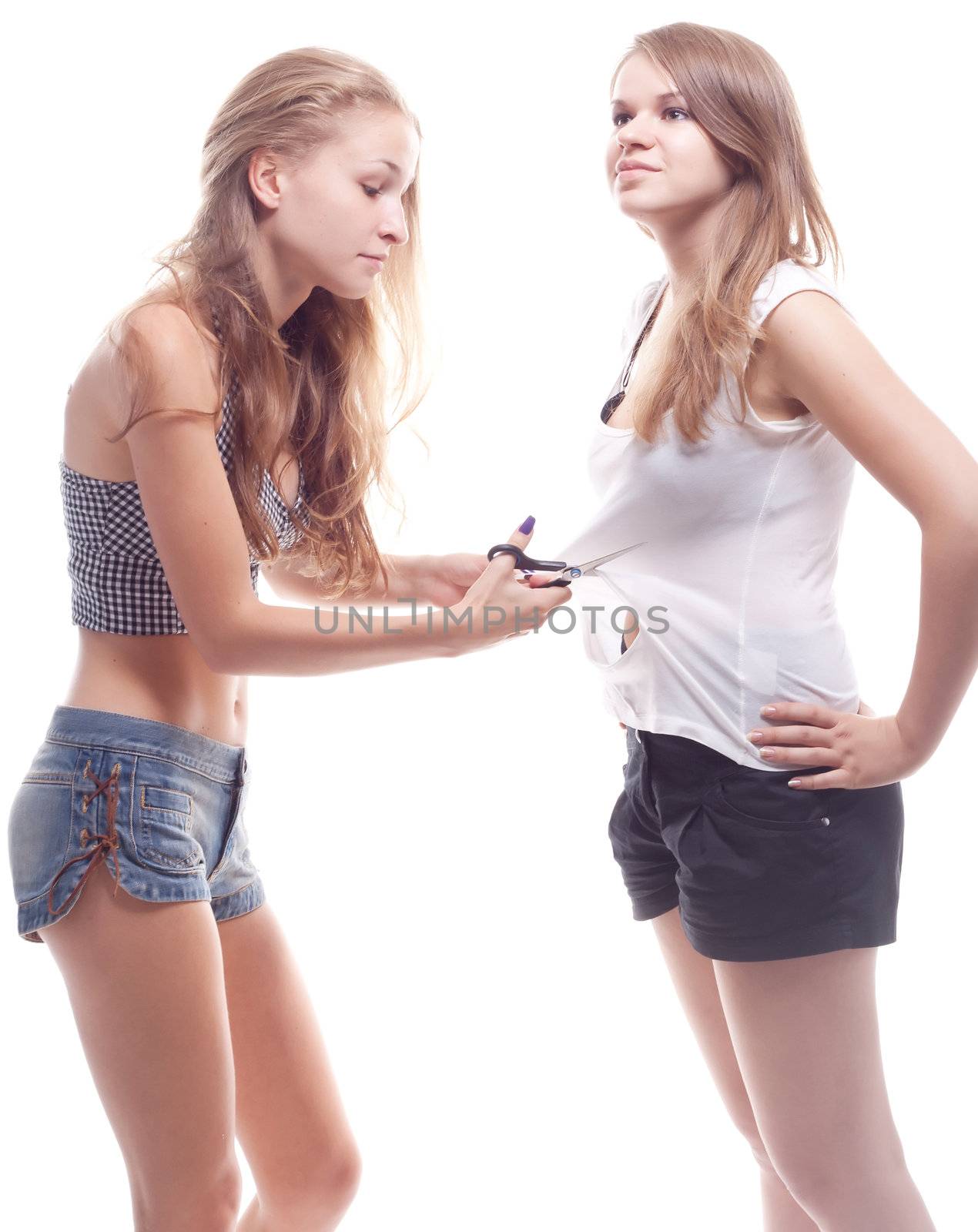 The girl cut shirt on another girl studio photography