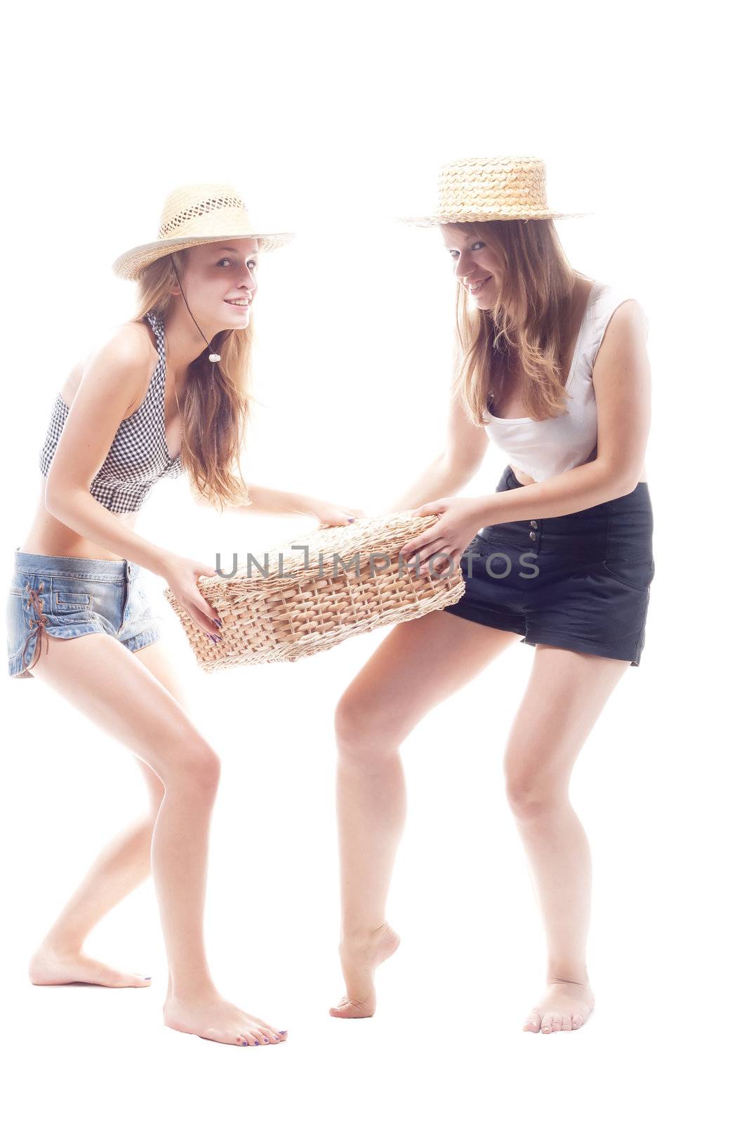 Two girls in straw hats with a straw suitcase by victosha
