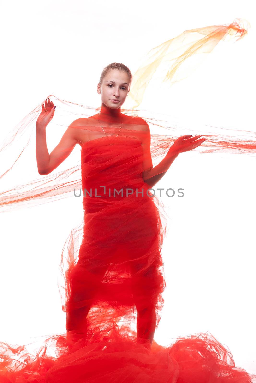 Beautiful girl in a red cloth studio shooting