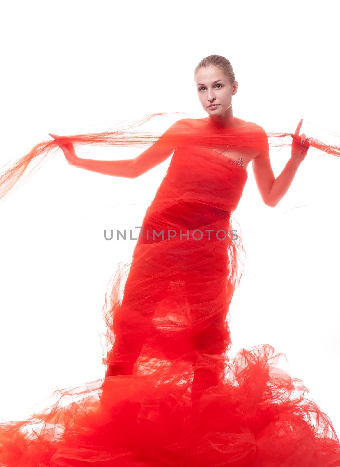 Beautiful girl in a red cloth studio shooting