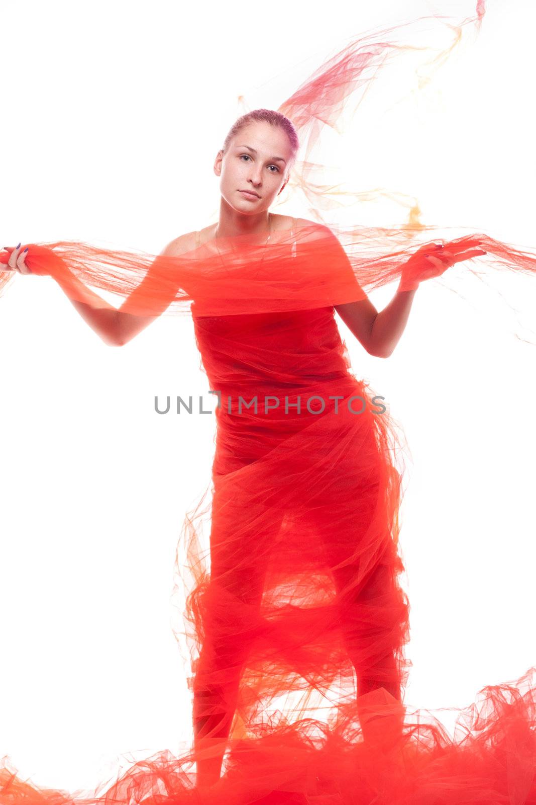 Beautiful girl in a red cloth studio shooting