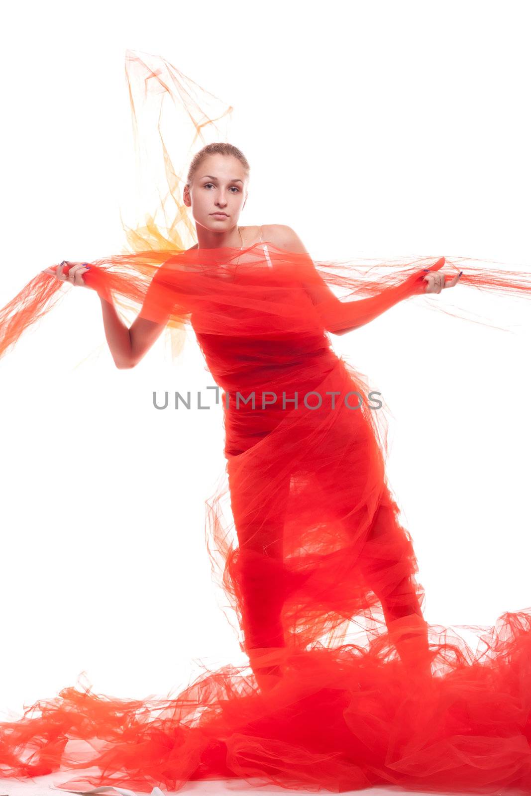 Beautiful girl in a red cloth studio shooting