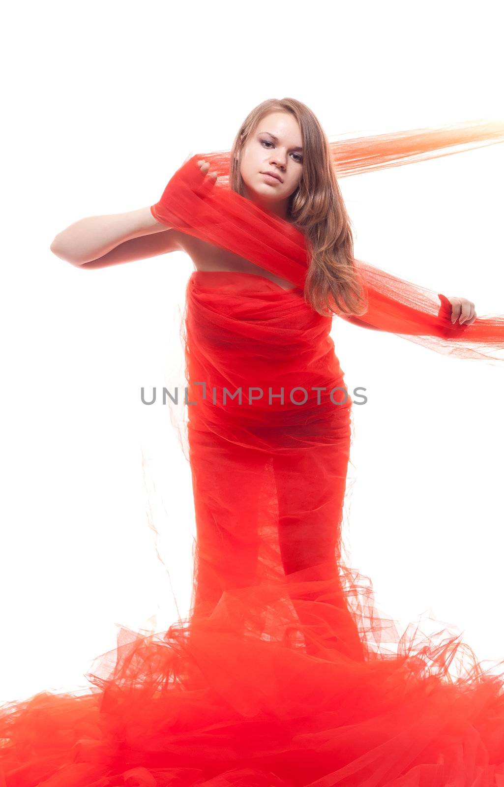 Beautiful girl in a red cloth studio shooting