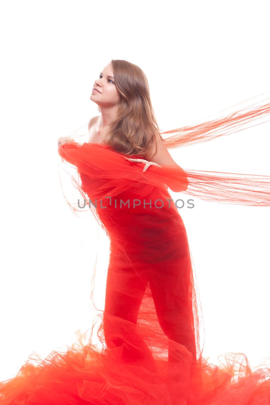 Beautiful girl in a red cloth studio shooting