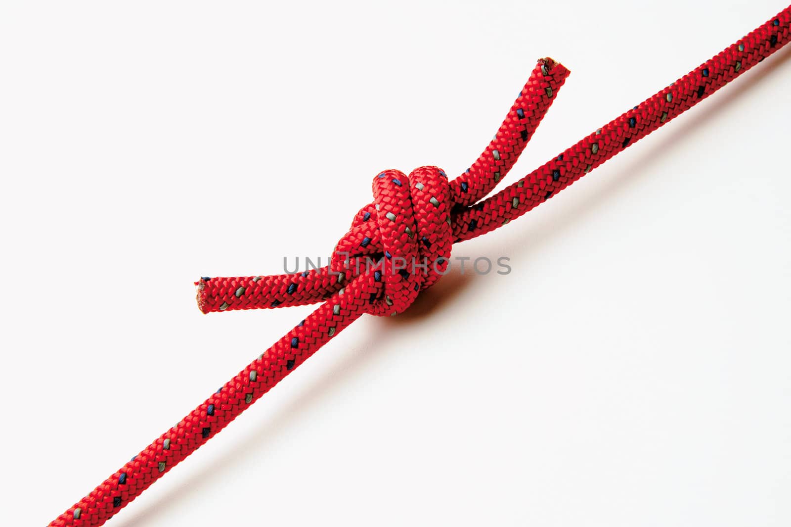 A knot on very strong climber red rope