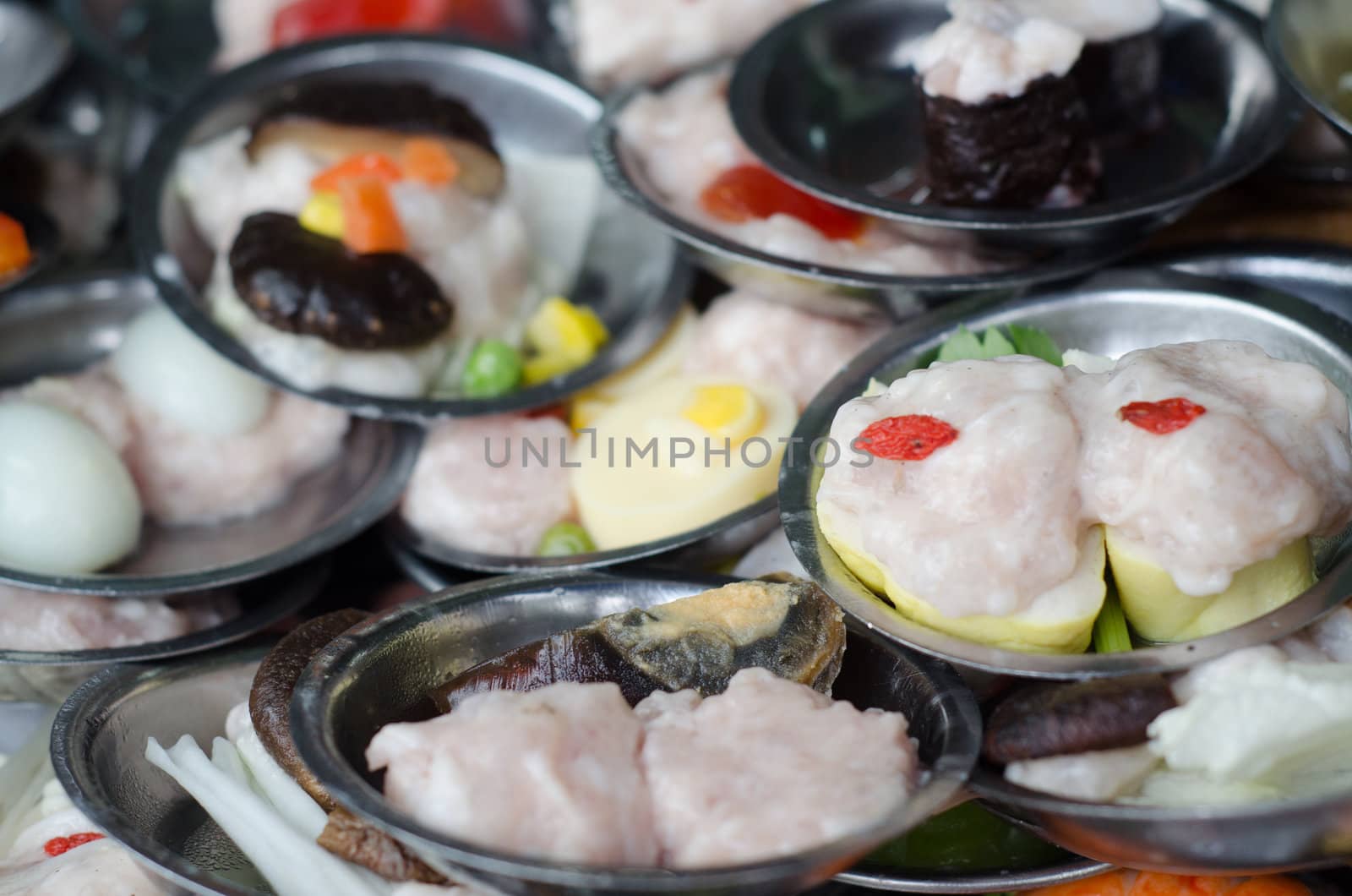 Dimsum chinese food on restaurant served in small metal place by ngarare