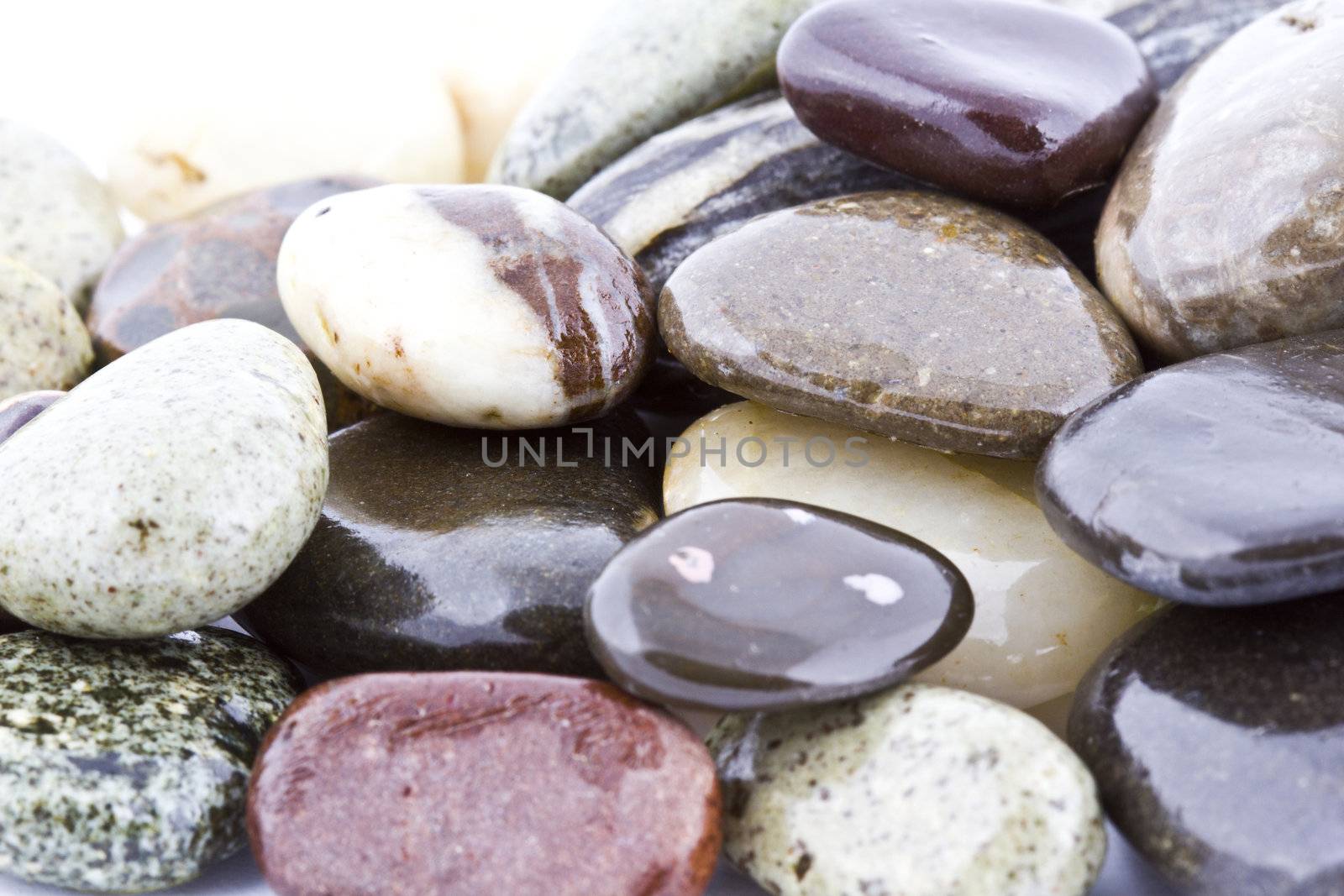 Wet pebble stones natural background. Close-up