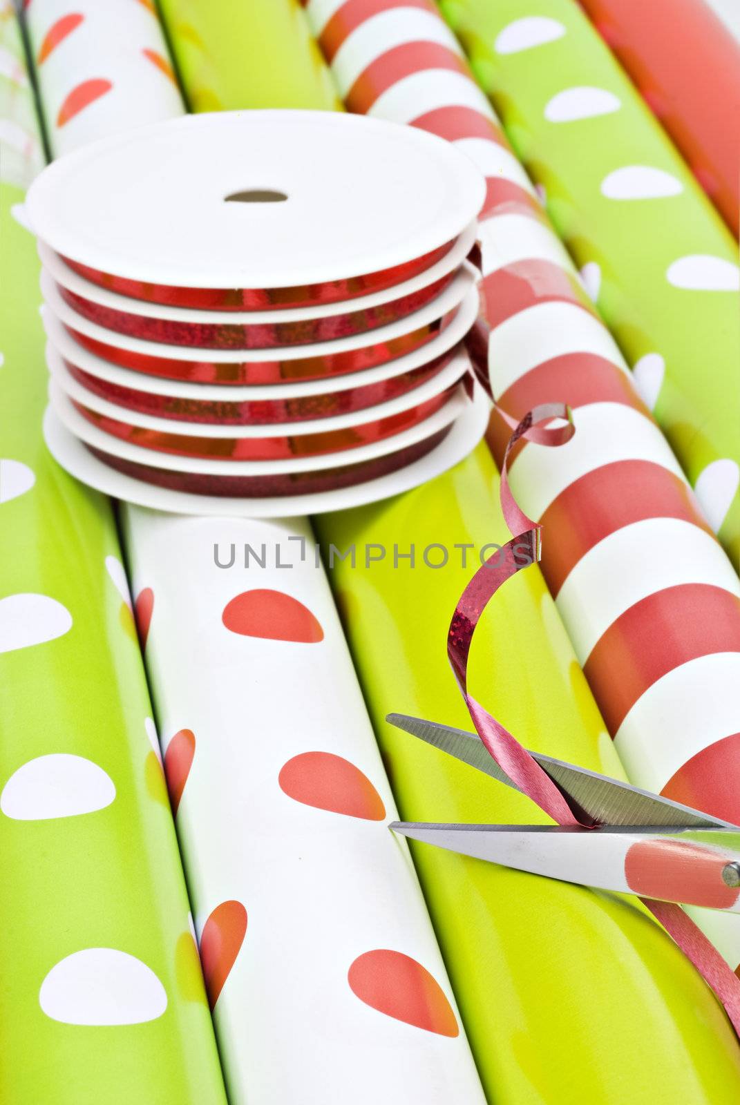 Rolls of gift wrapping paper and rolls of ribbon