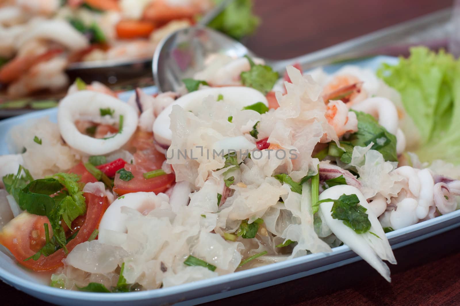 mix white mushroom with sea food on dish