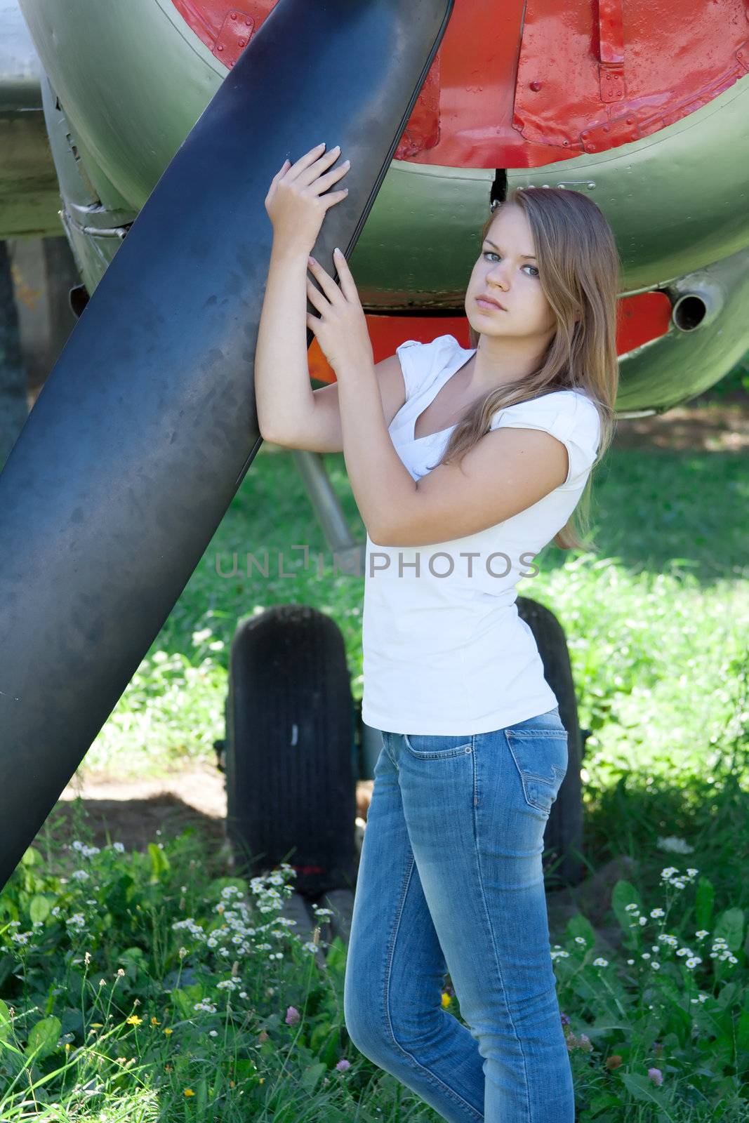 beautiful girl on the background plane survey at the Museum