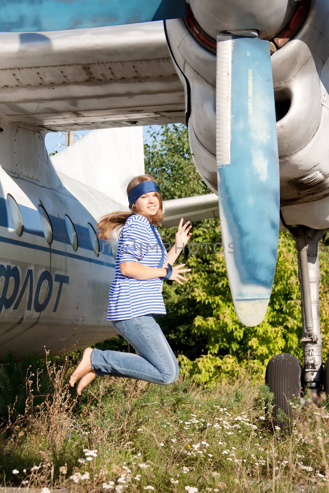 beautiful girl on the background plane survey at the Museum