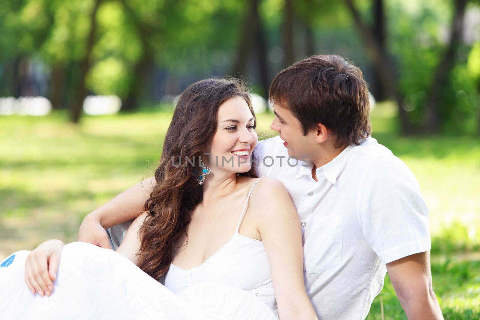 Young love Couple smiling under blue sky by sergey_nivens