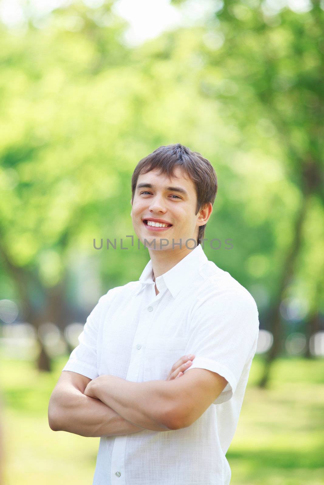 Handsome young man in the park. Outdoor portrait