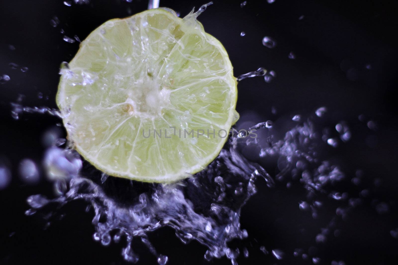 water splash with lemon in a black background