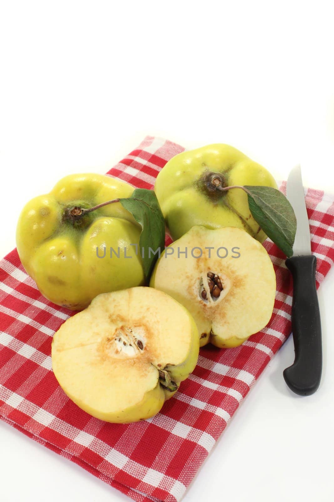 three quinces on a white background