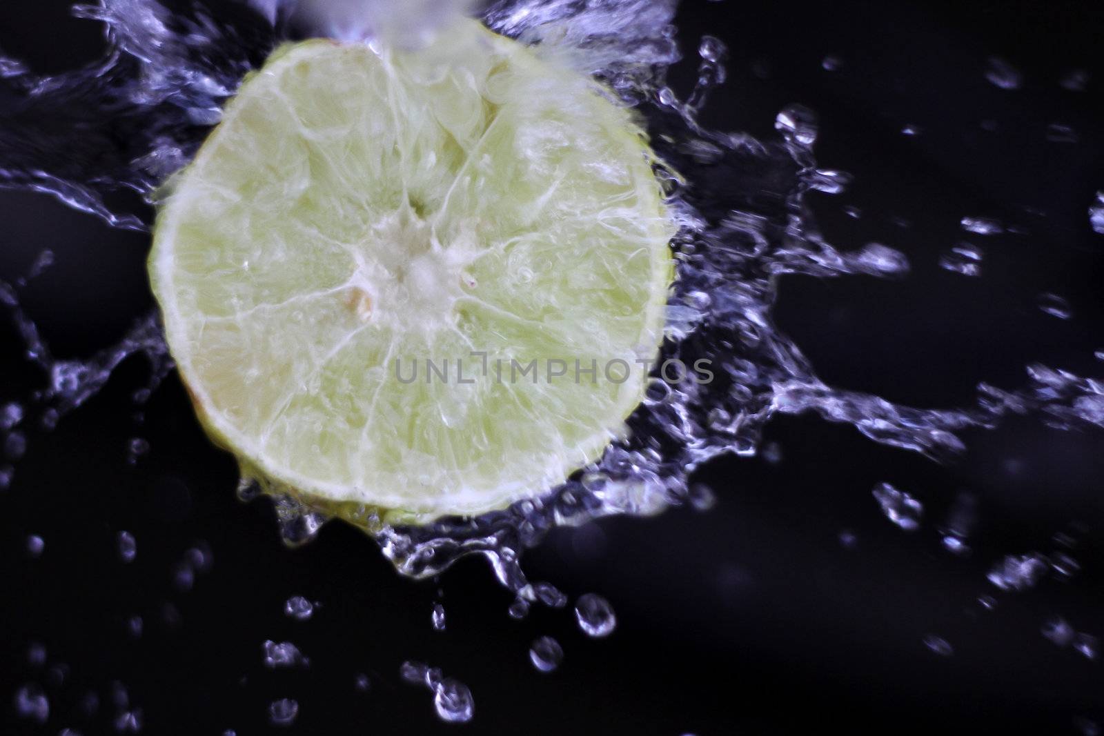 water splash with lemon in a black background