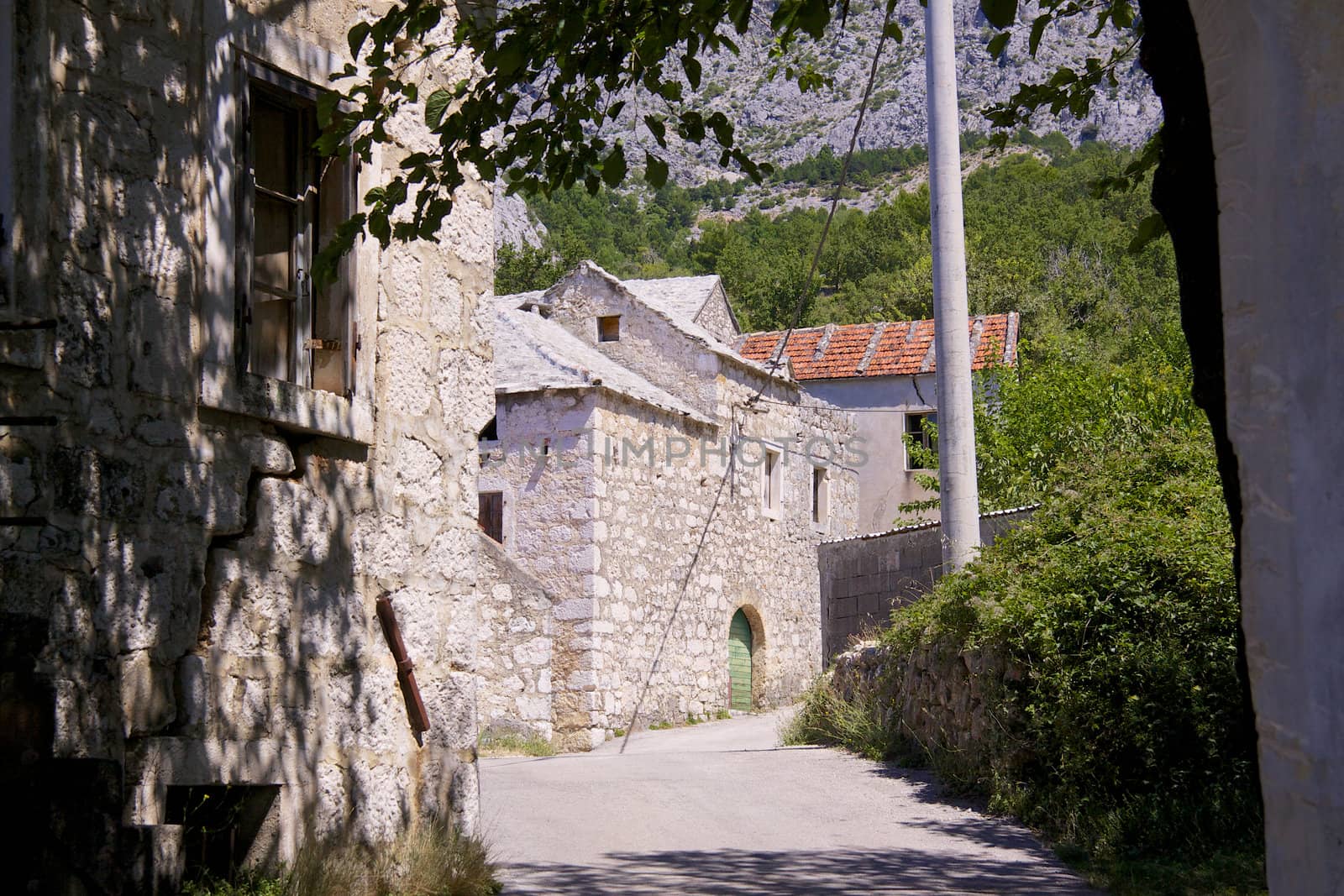 Typical stone houses in old village of Tucepi on Makarska Riviera in Dalmatia, Croatia