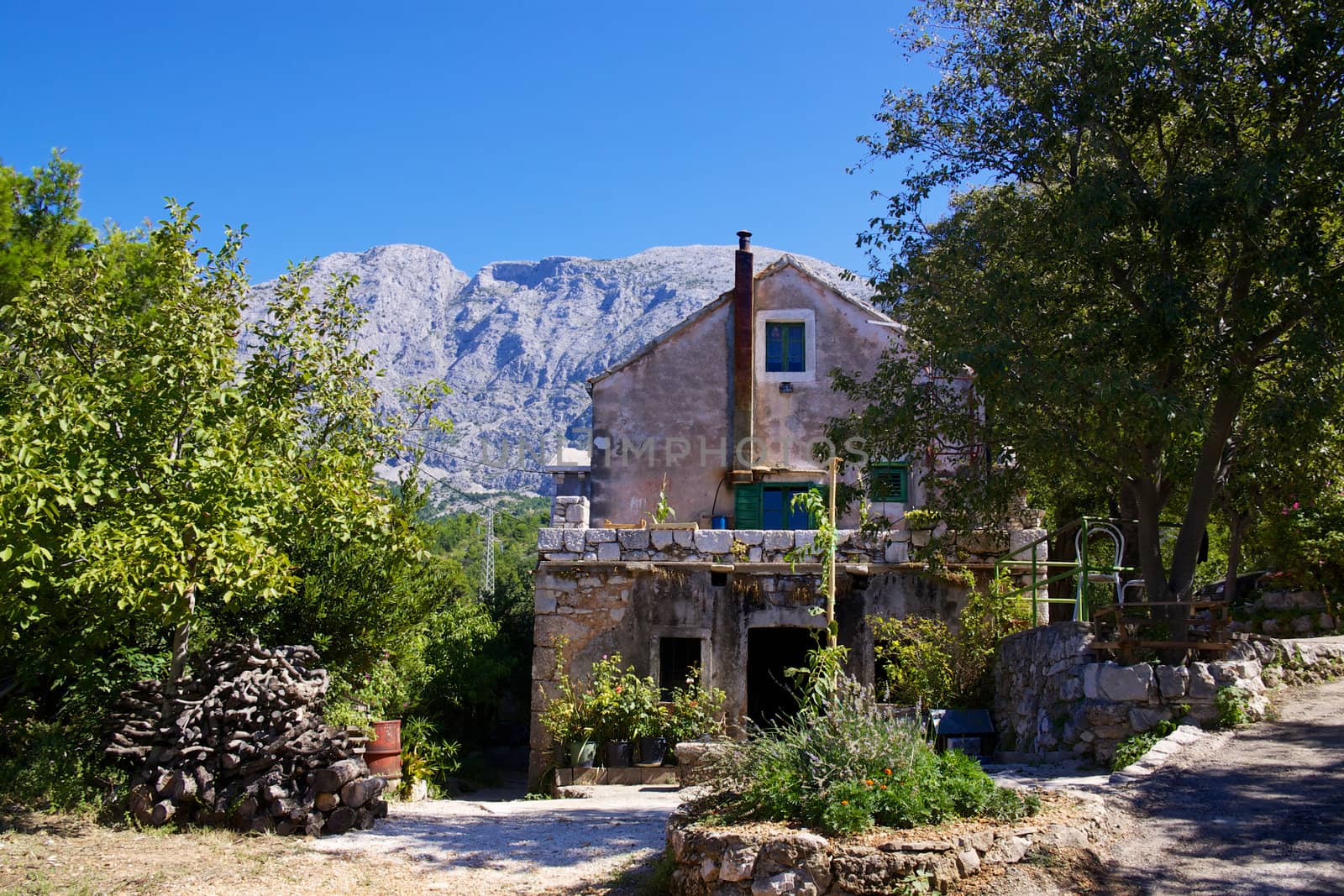 Traditional croatian house in old village of Tucepi on Makarska Riviera in Dalmatia.