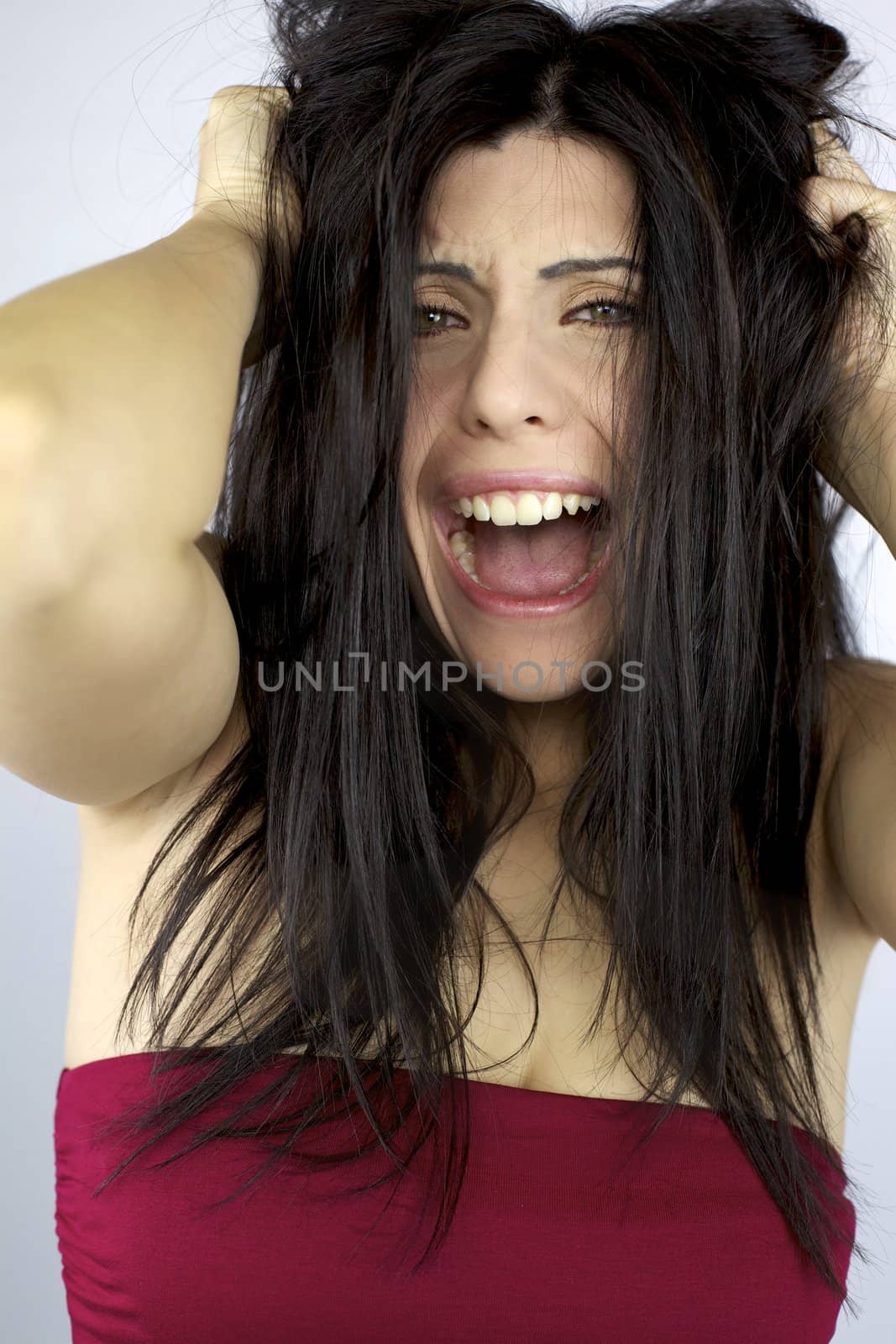 Woman shouting and screaming desperate about her hair by fmarsicano