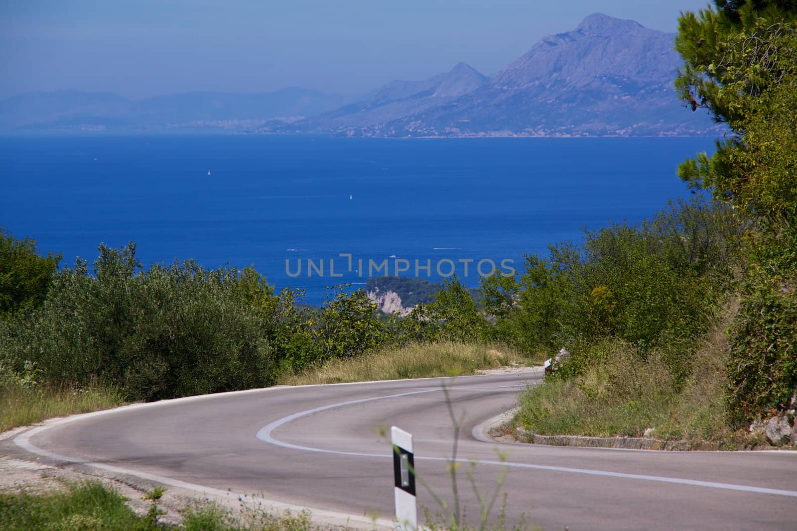 Steep road on Makarska Riviera in Dalmatia, Croatia, popular summer holiday resort in Europe with crystal clear water and sunny weather