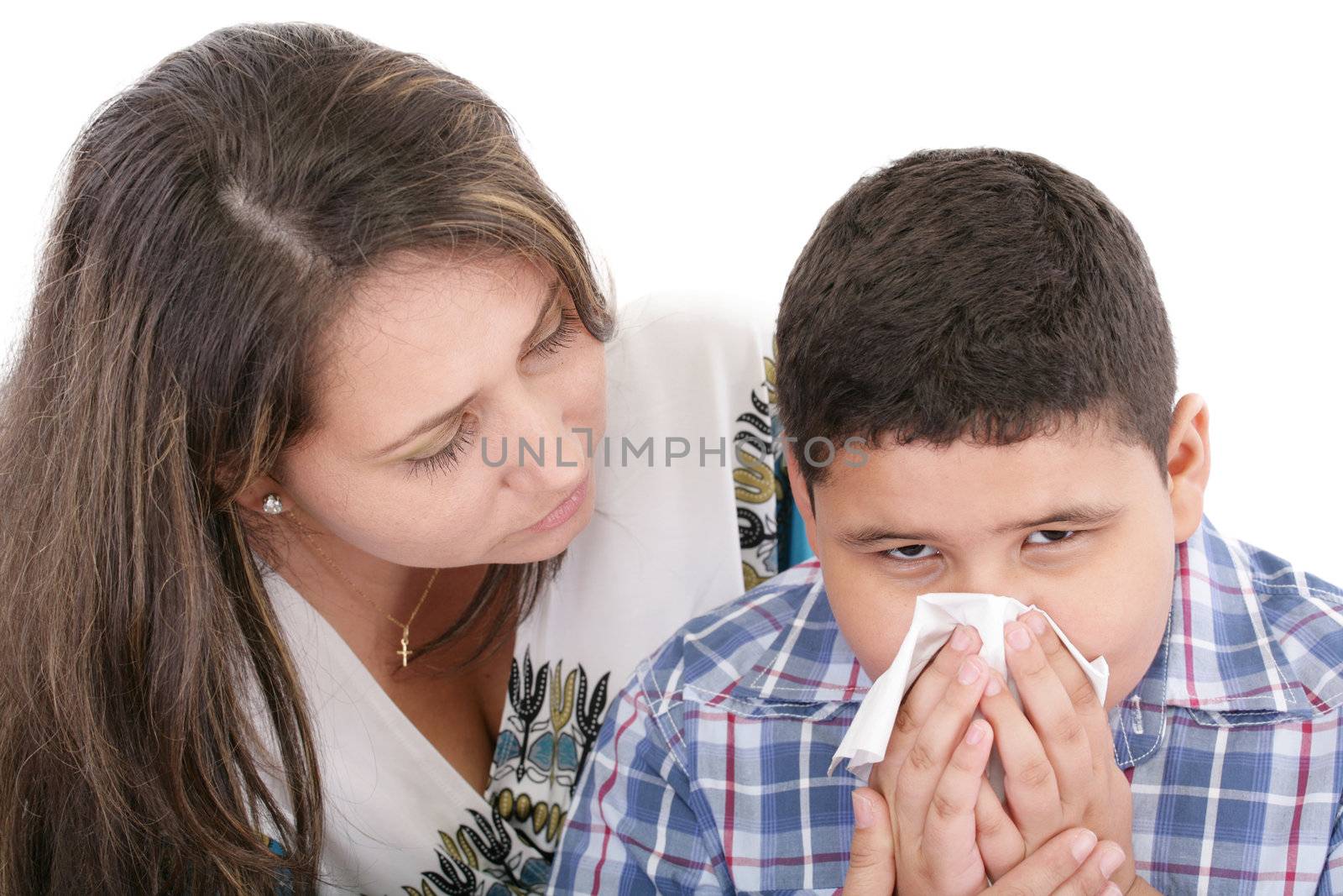 Child blowing nose. Child with tissue. catarrh or allergy
