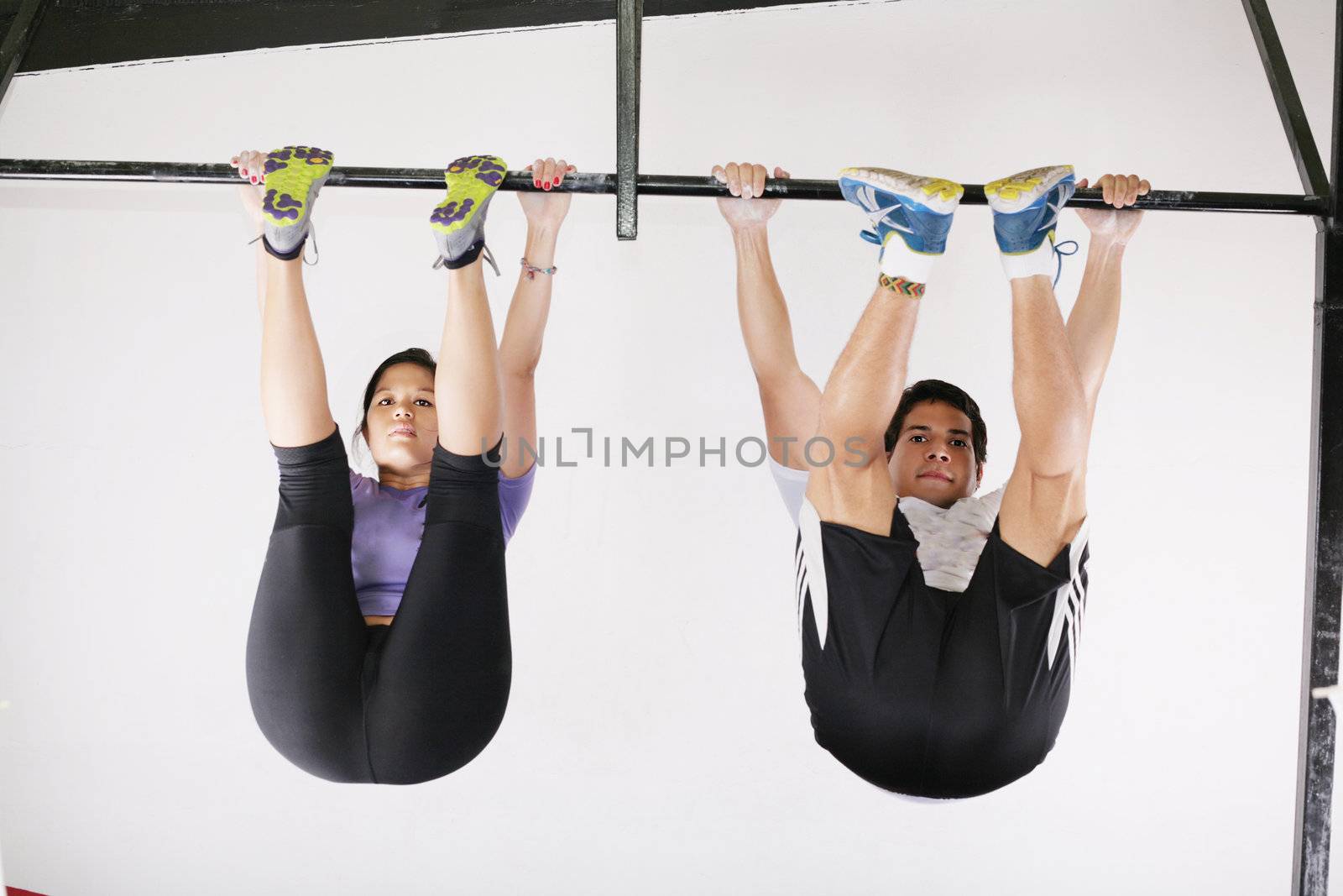 very power athletic group, execute exercise tightening on horizontal bar
