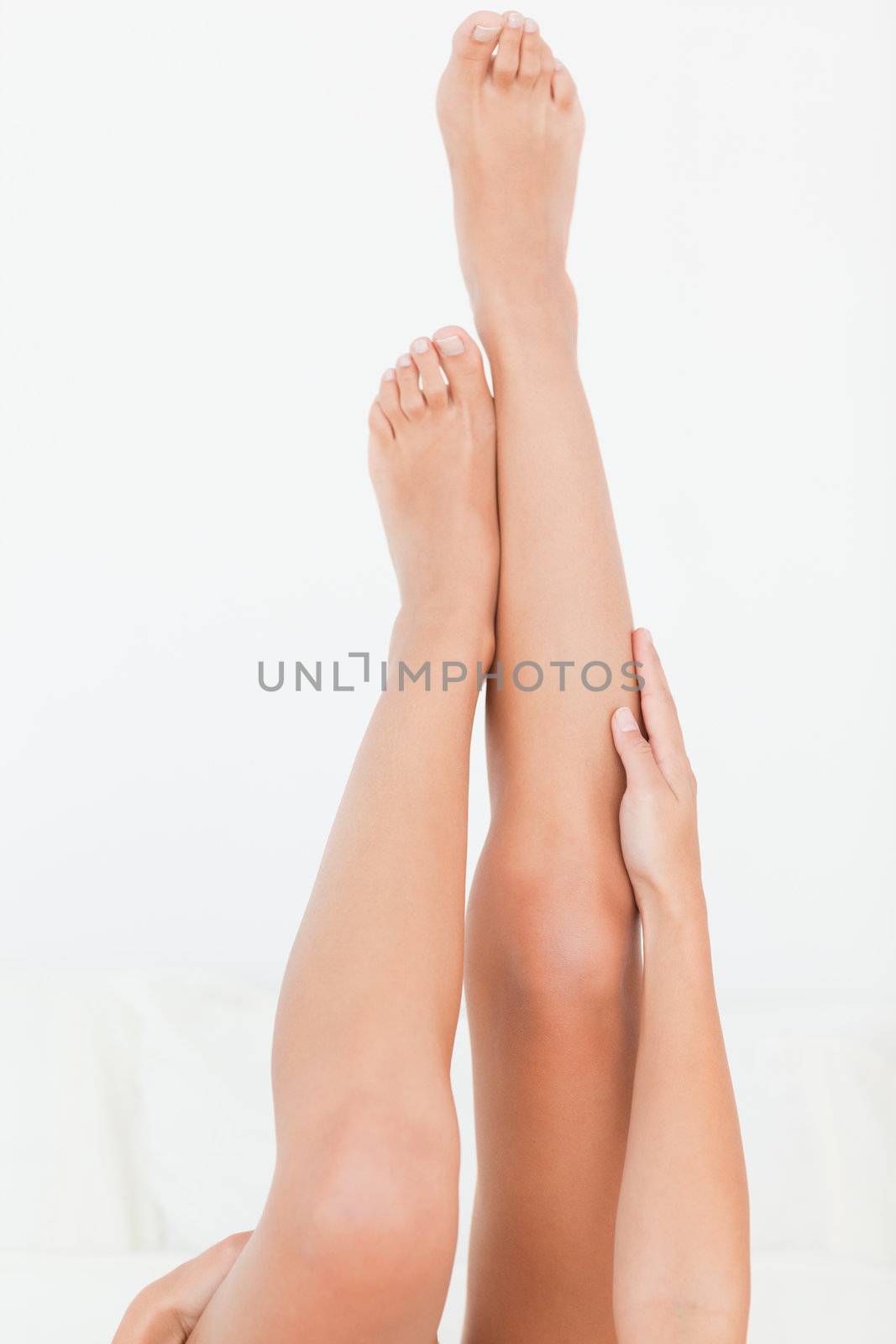 woman's legs raised up high by Wavebreakmedia