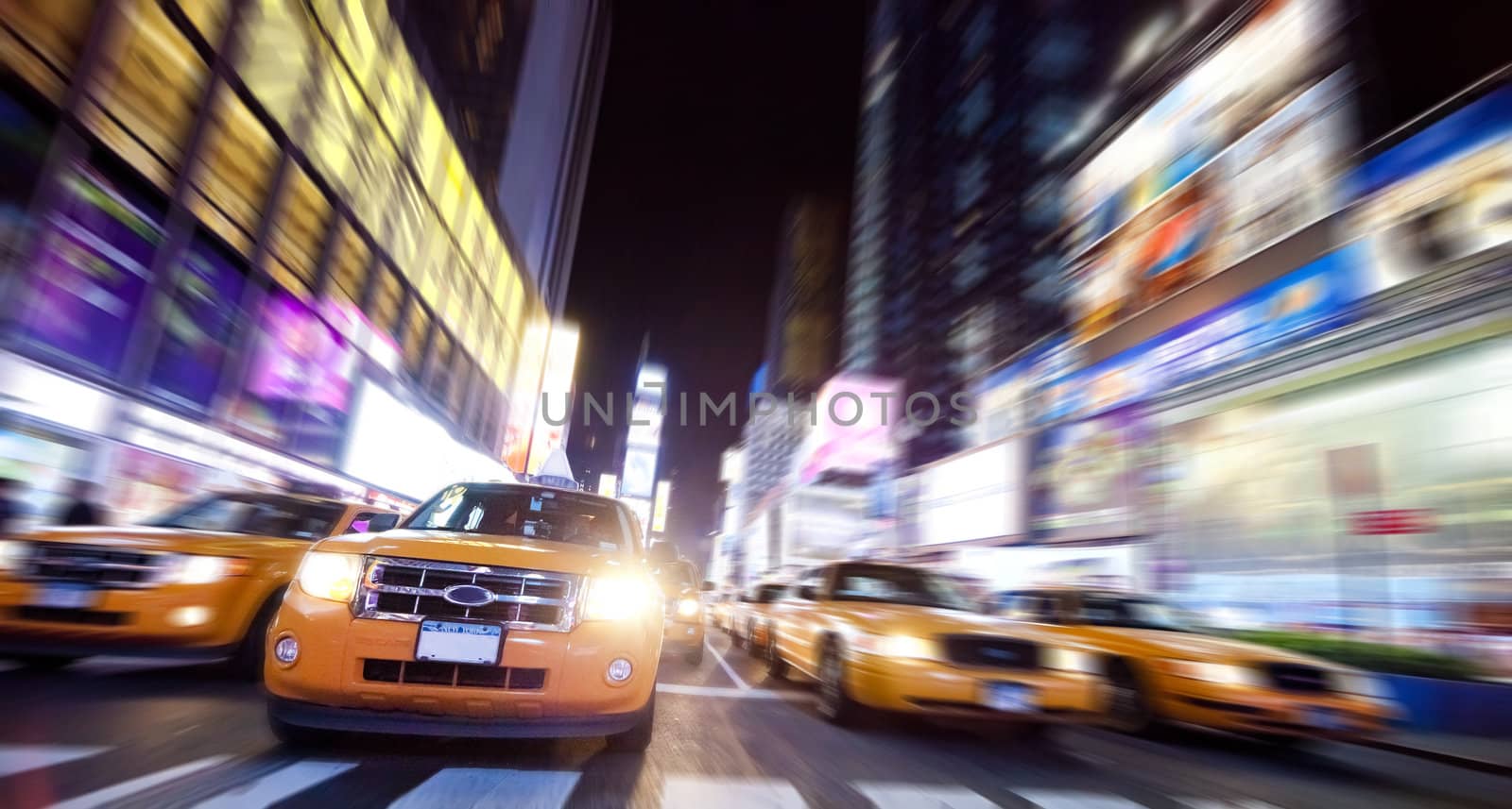 Time Square full of Taxi Cabs in the night
