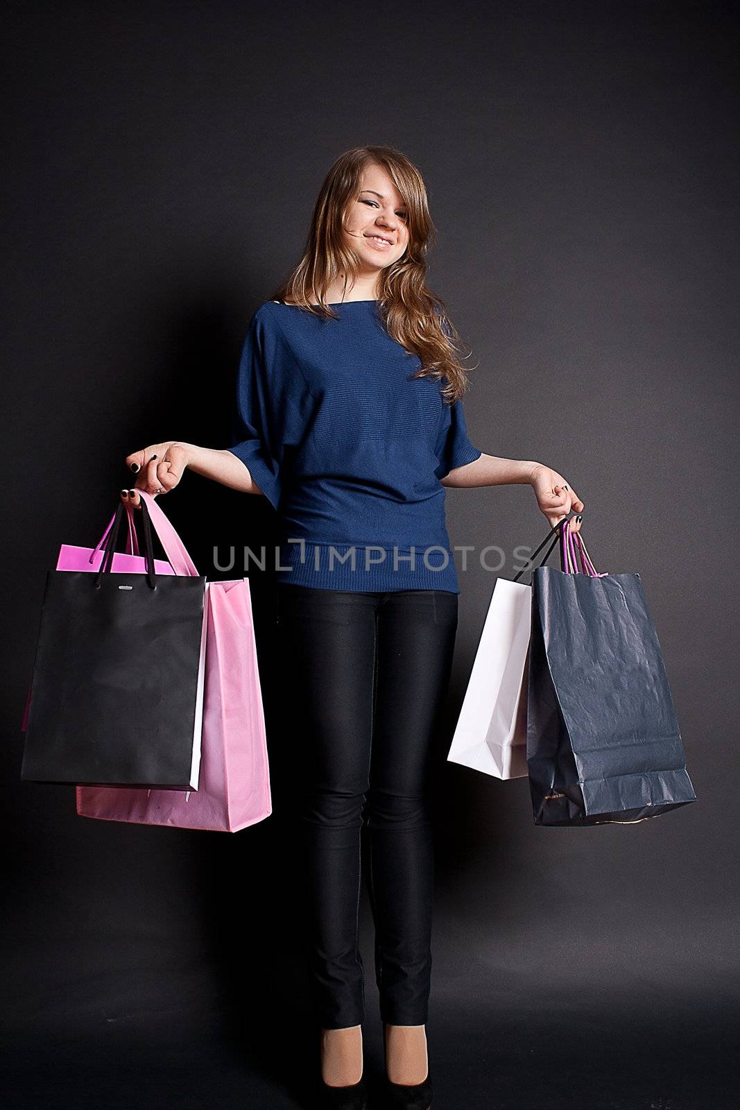 A happy girl with shopping bags after  by victosha