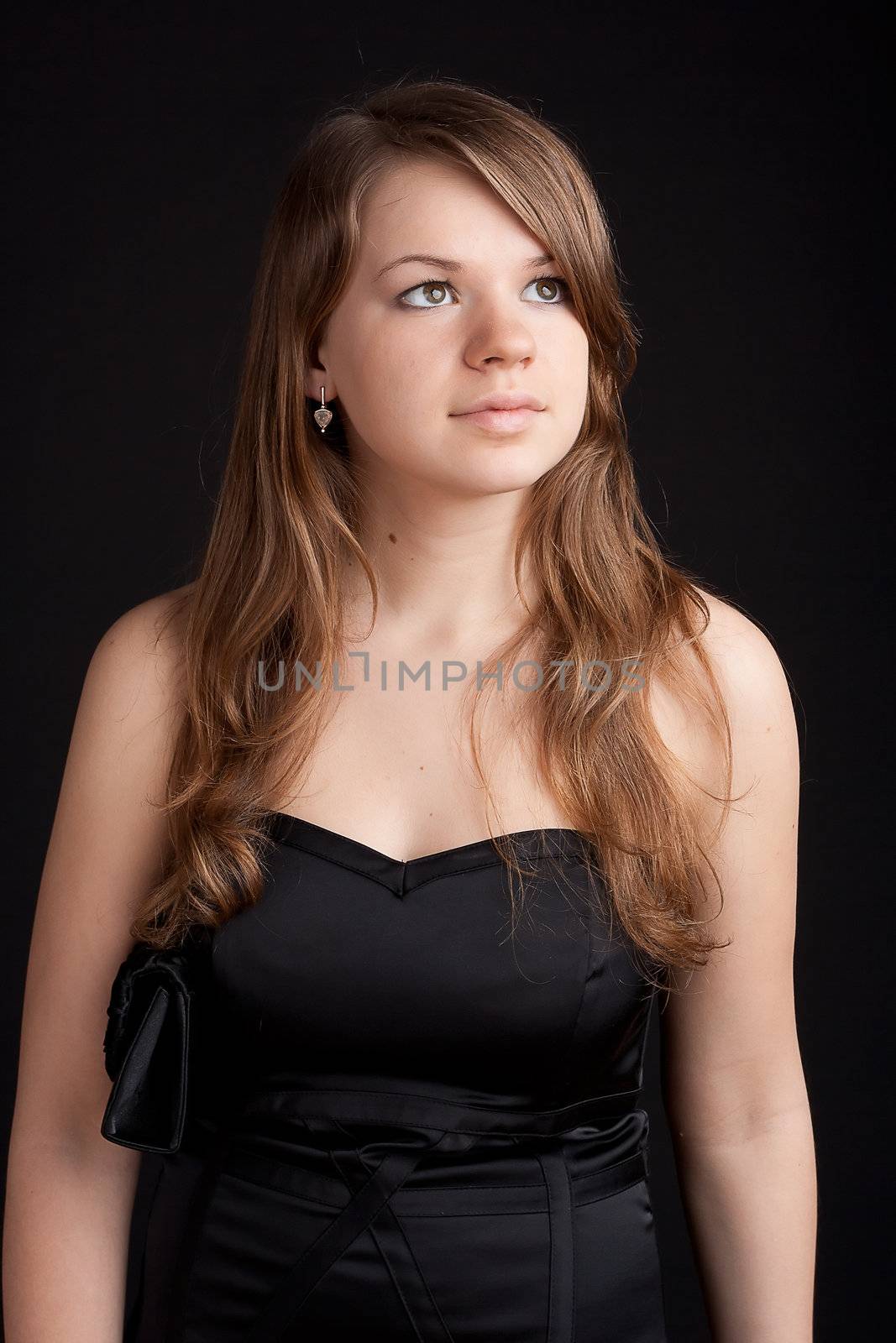 Beautiful girl in black dress photography studio