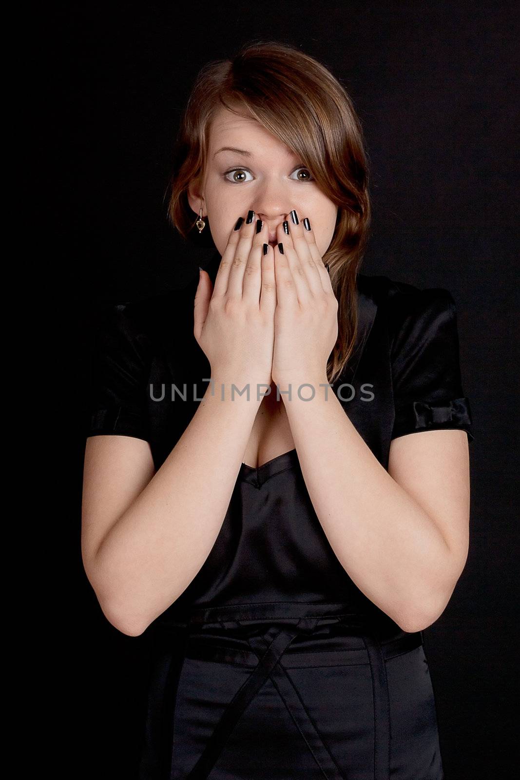 Frightened, she covers his mouth with his hands studio photography