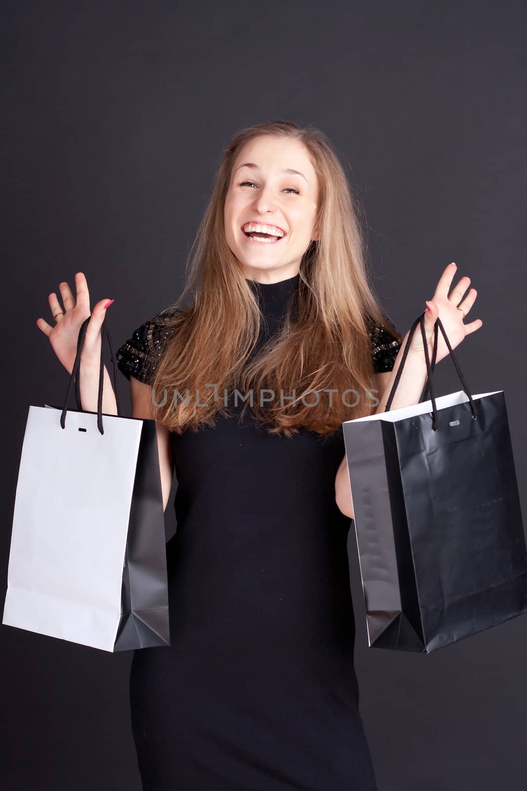 Happy girl with shopping studio photography