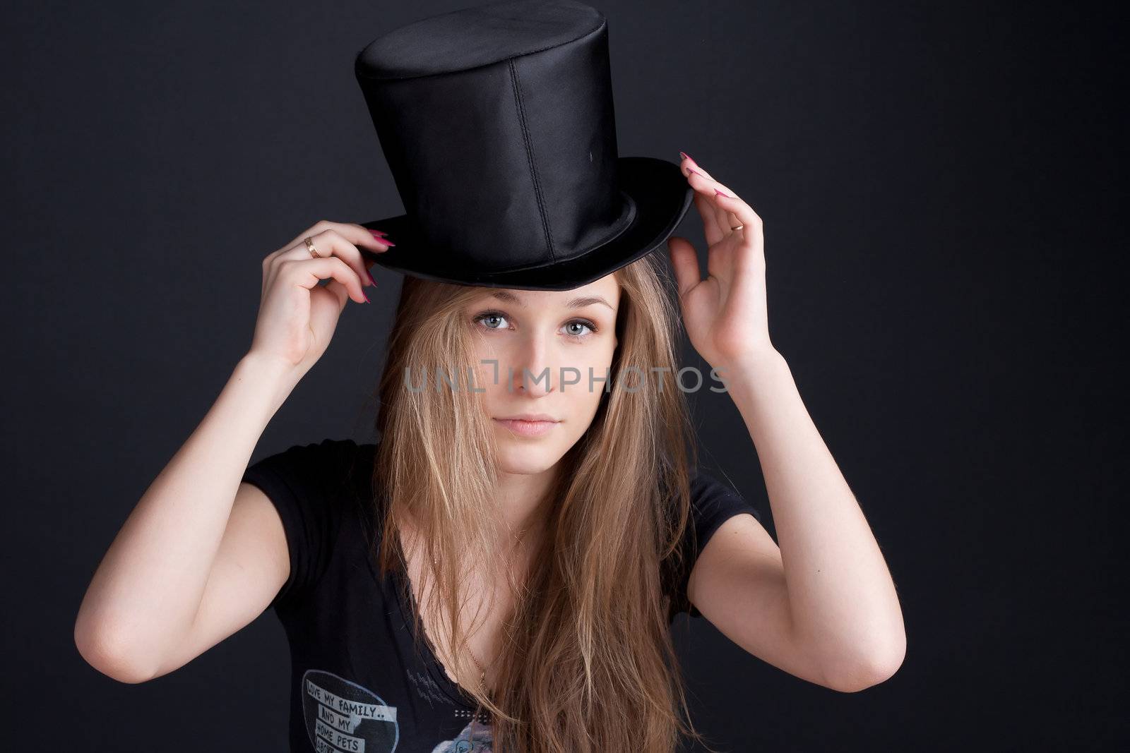 beautiful smiling girl in a black hat by victosha