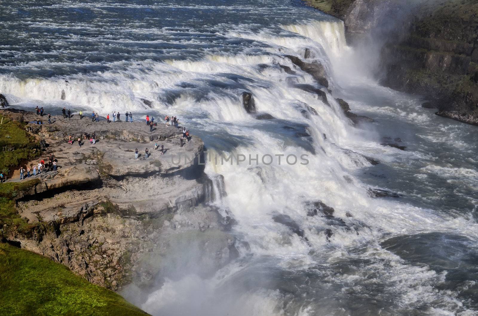 Gullfoss wild waterfall landscape, strong running water and people, Iceland