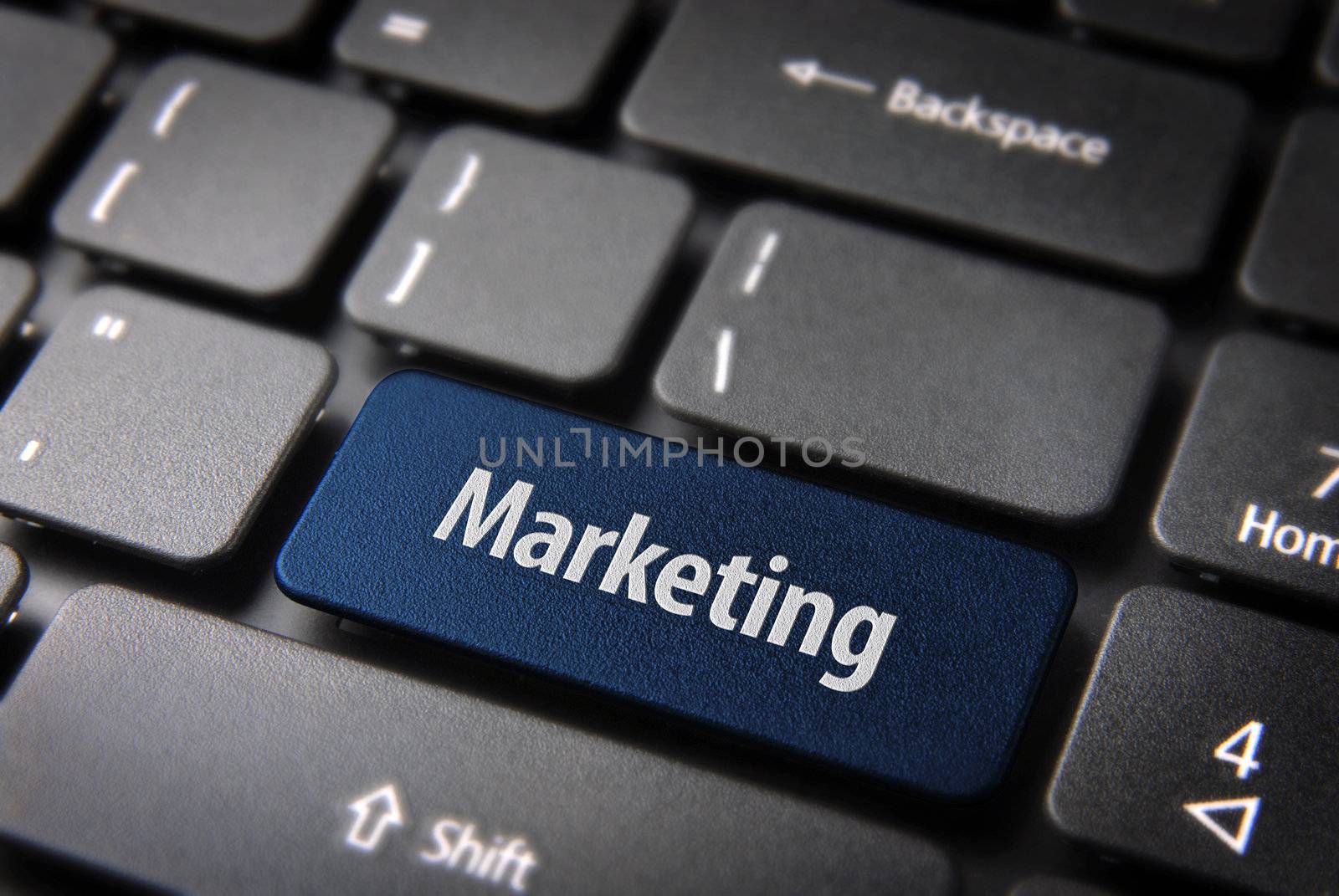 Blue key with marketing text on laptop keyboard. Included clipping path, so you can easily edit it.