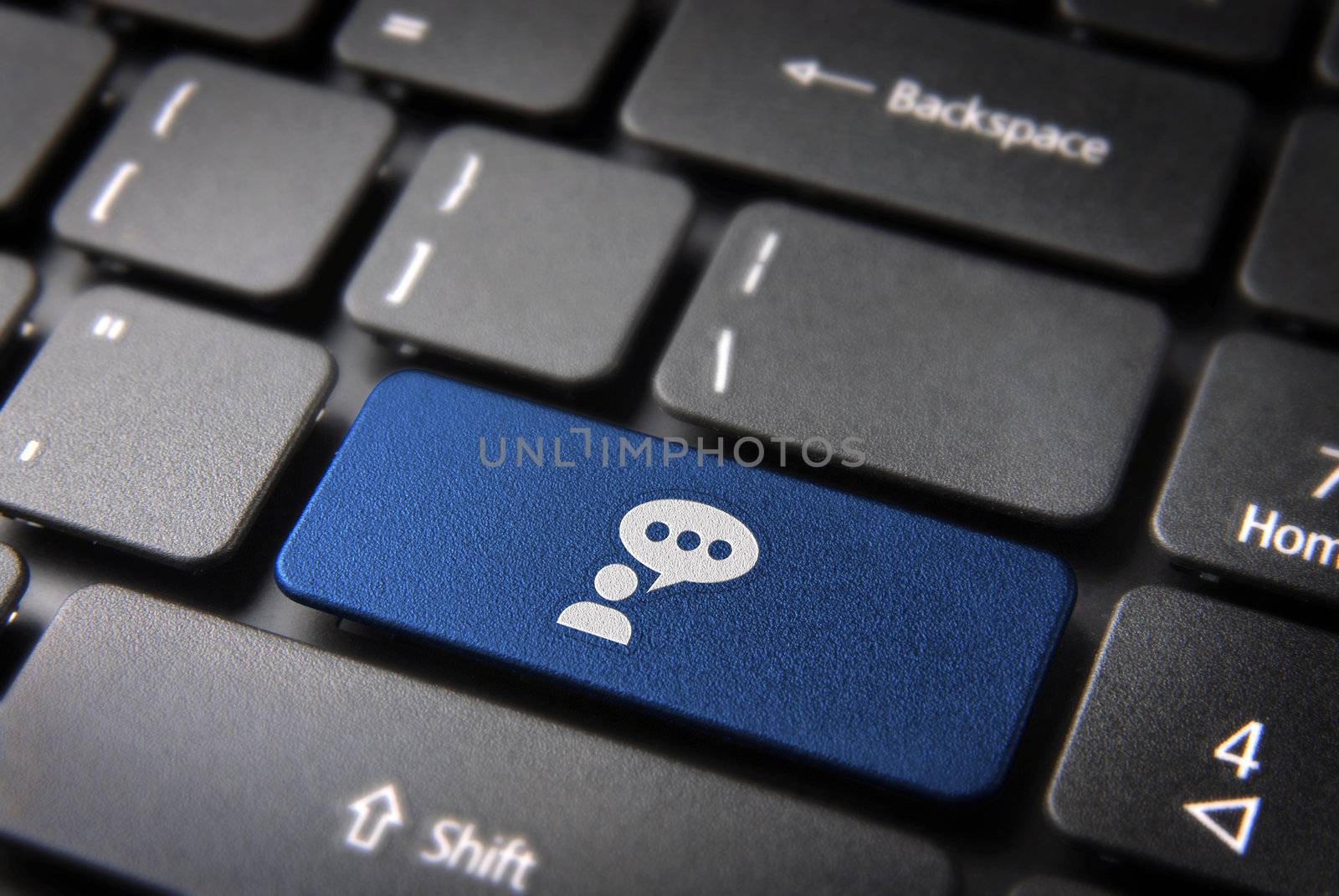 Social media key with people chat icon on laptop keyboard. Included clipping path, so you can easily edit it.
