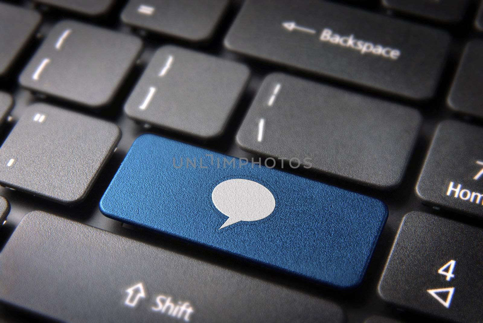 Social media key with speech bubble icon on laptop keyboard. Included clipping path, so you can easily edit it.