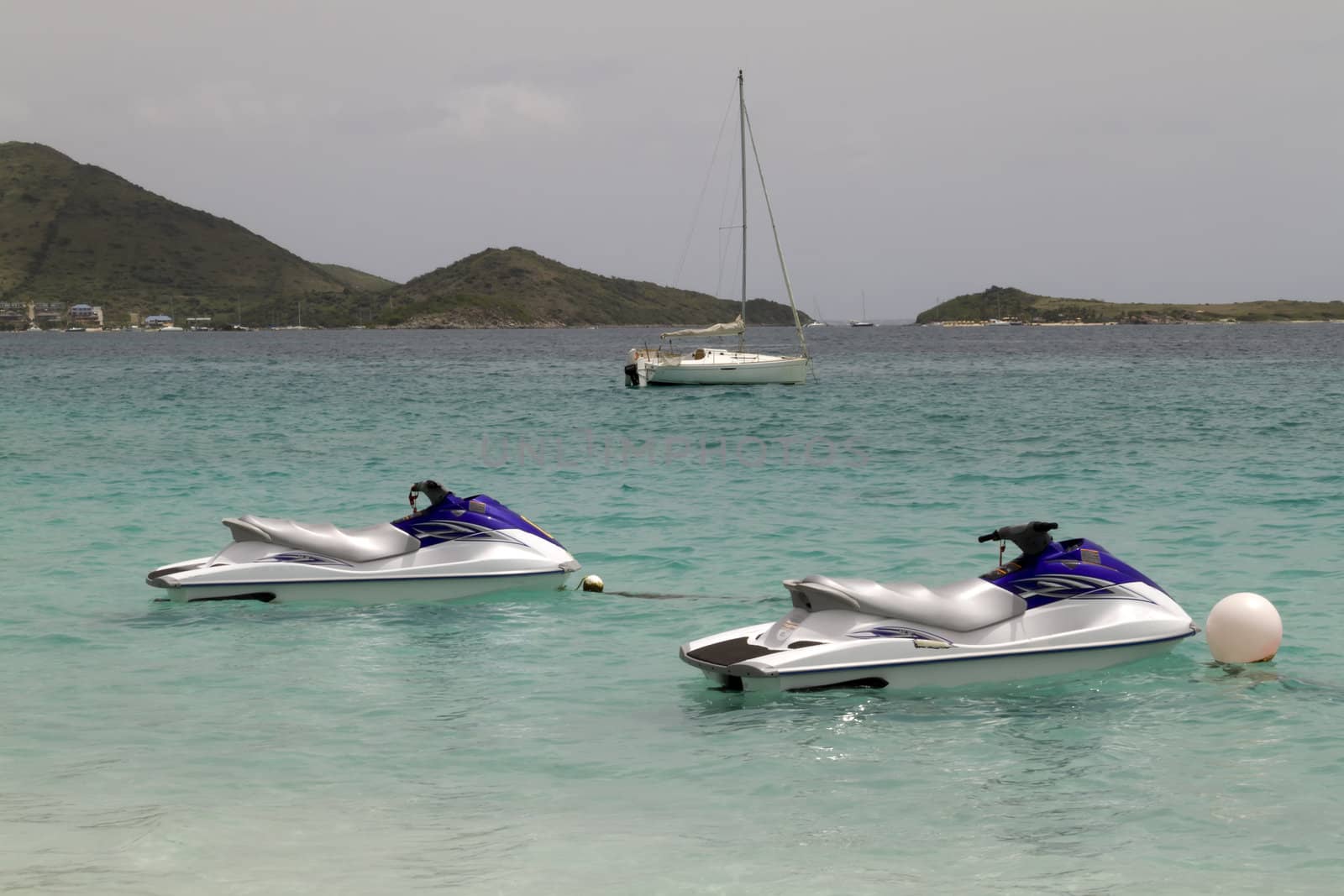 Two jet skies tied up in the Caribbean Sea
