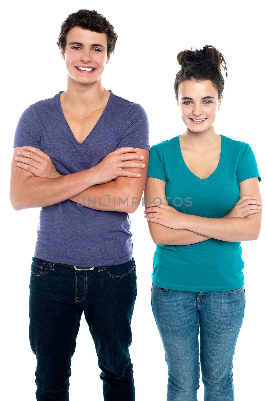 Confident teen with their arms crossed isolated against white background