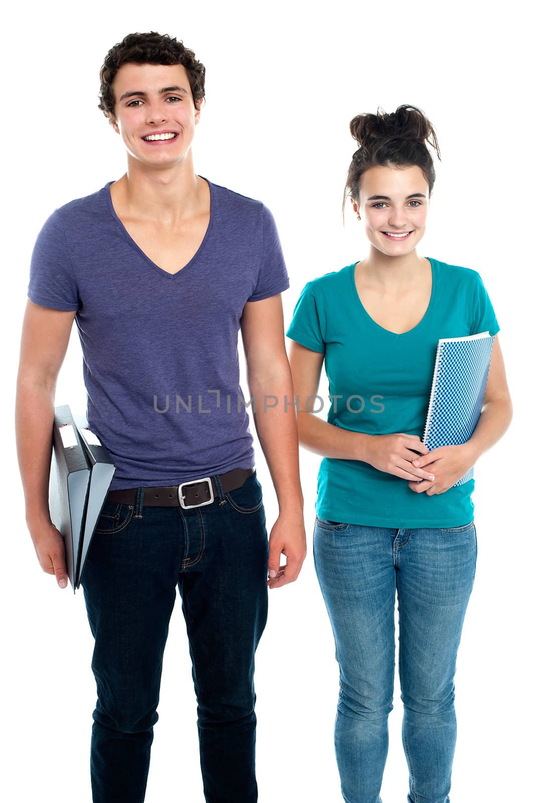 Fashionable college going students posing over white background
