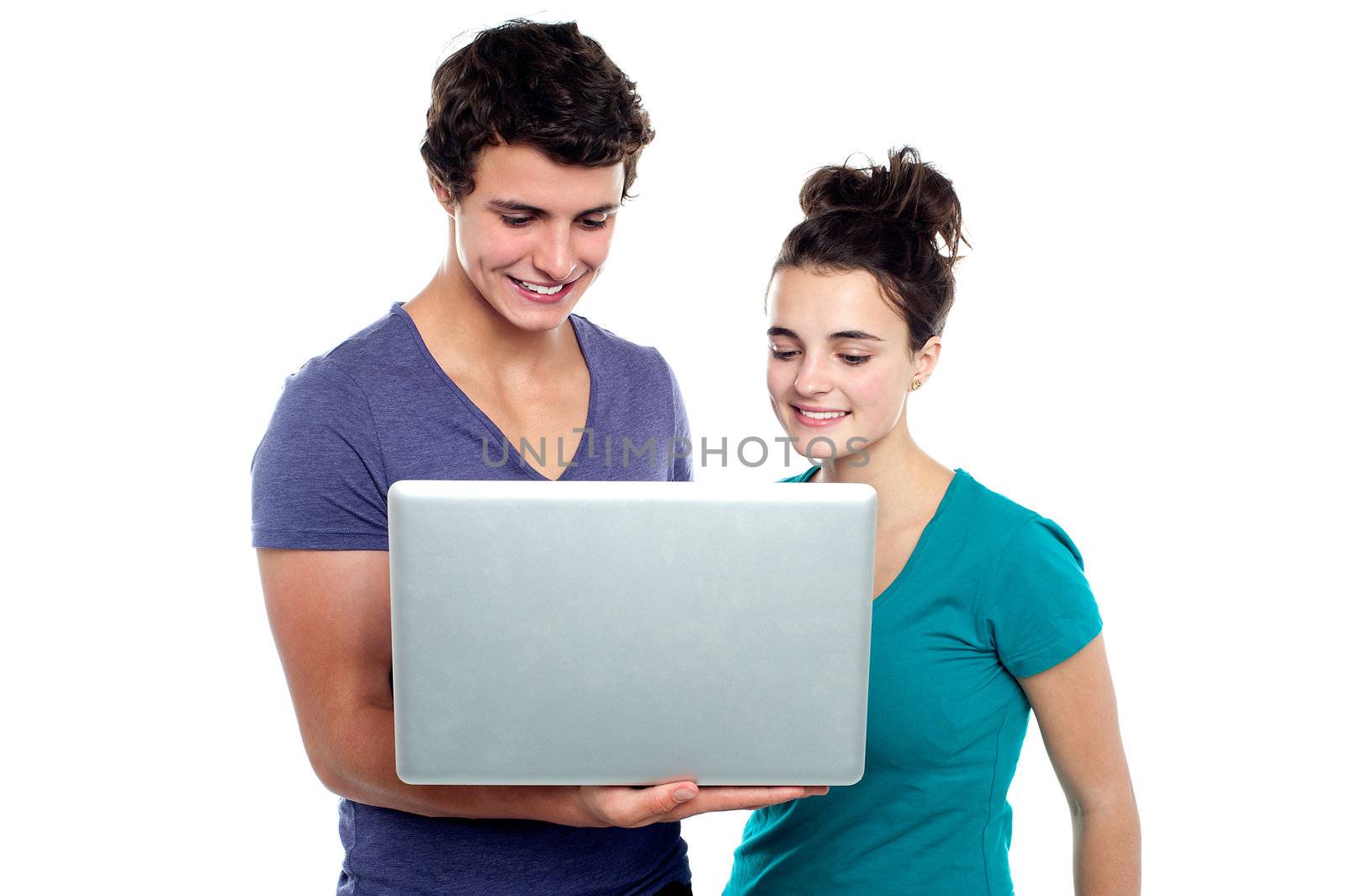 Couple looking into the laptop isolated on white background