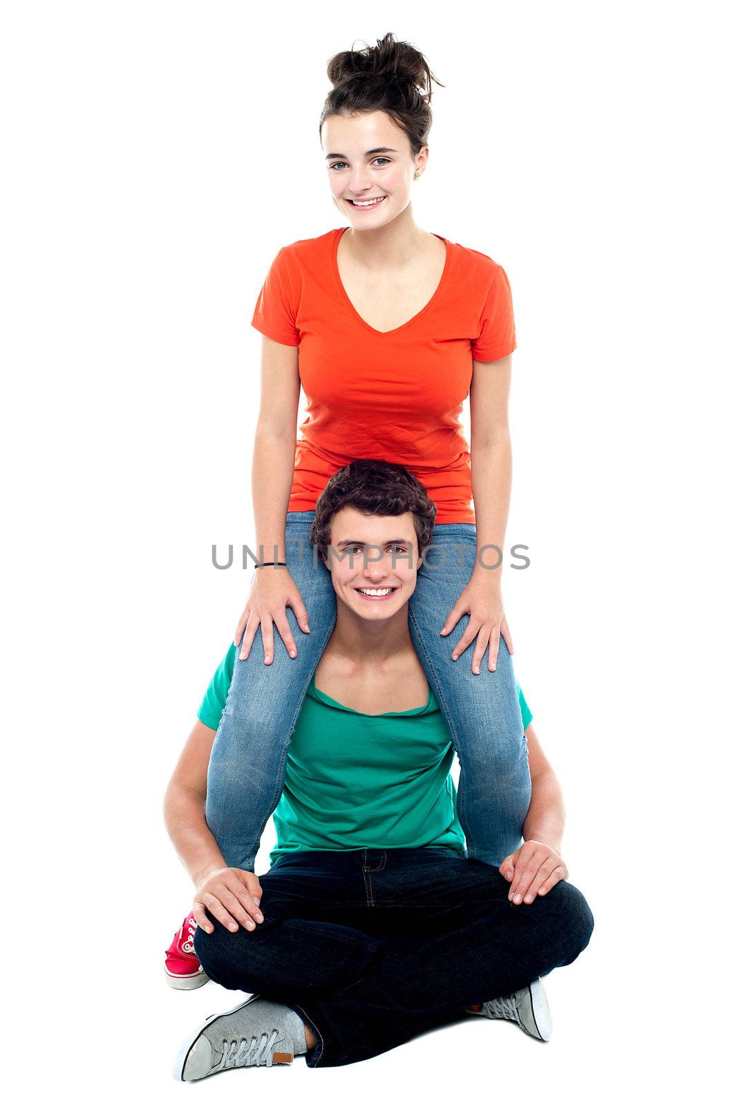 Girl riding on her boyfriend's shoulder. Both having fun