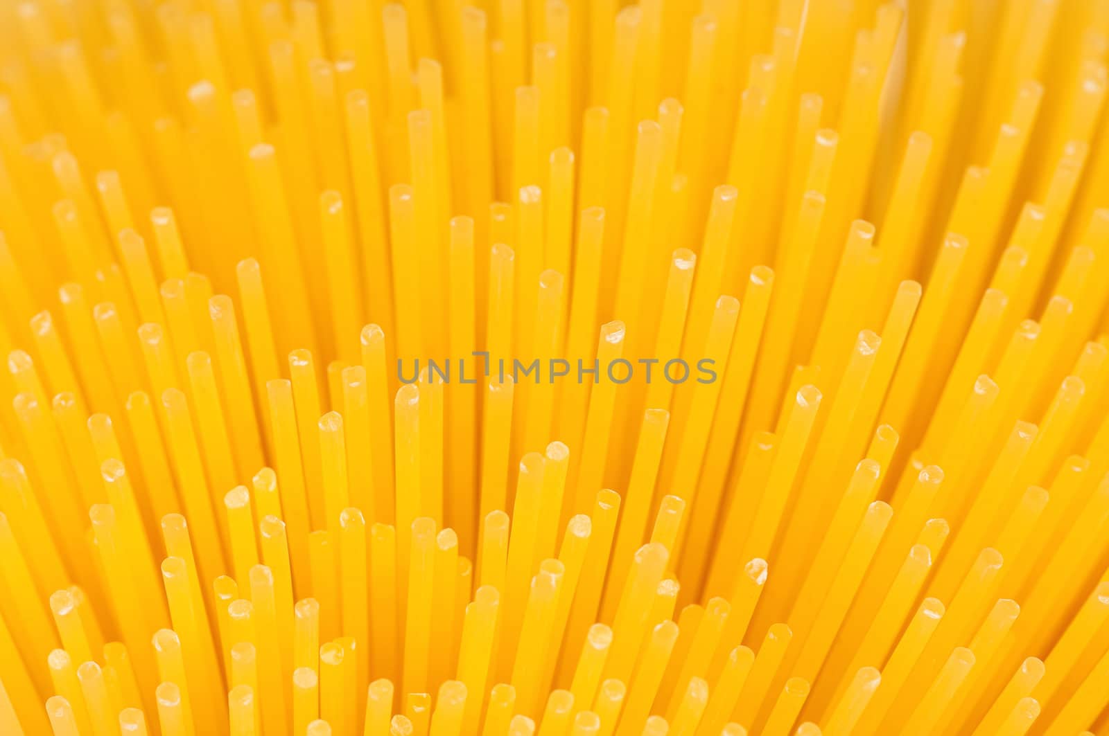 Close-up of long uncooked italian spaghetti background