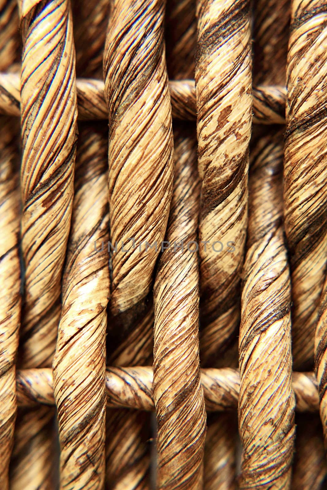 The texture of wicker baskets in beige - macro