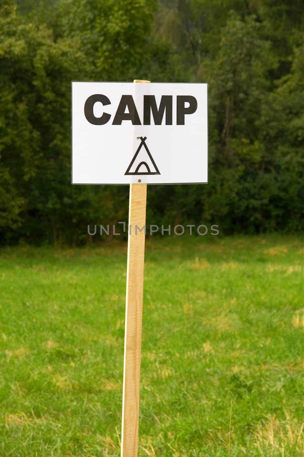 Camping sign on a field