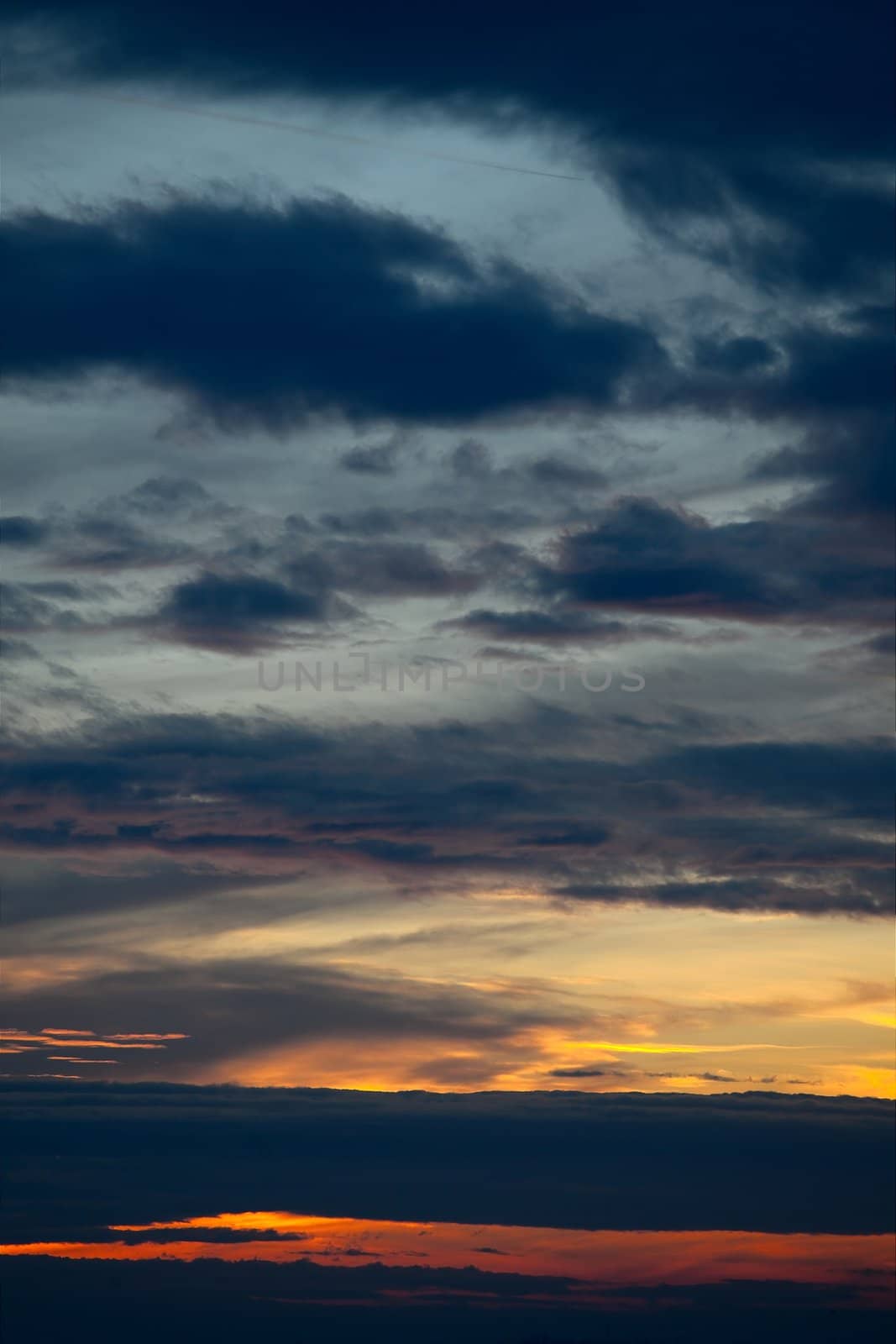 Sunset sky with clouds in different colors