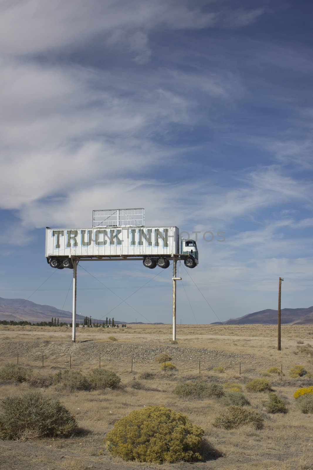 Old abandoned semi truck sign in the middle of the desert. The sign is from an old Inn that was demolished over 50 years ago.
