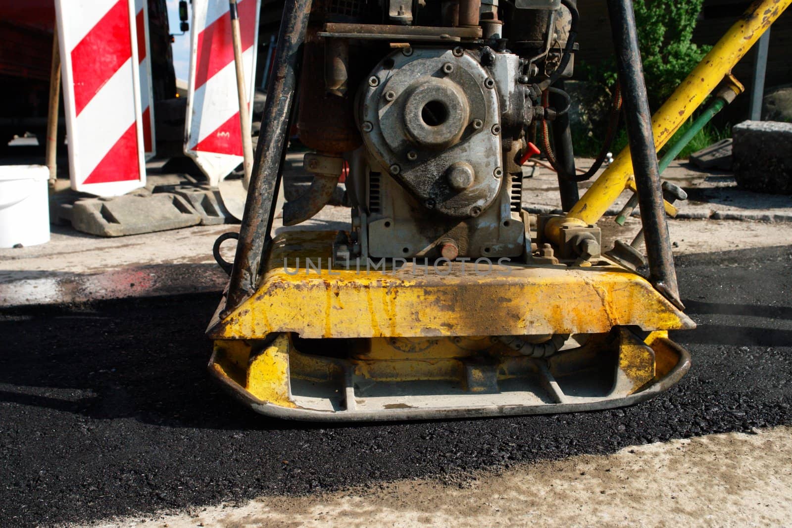 A compactor used on a roadwork A compactor used on a roadwork